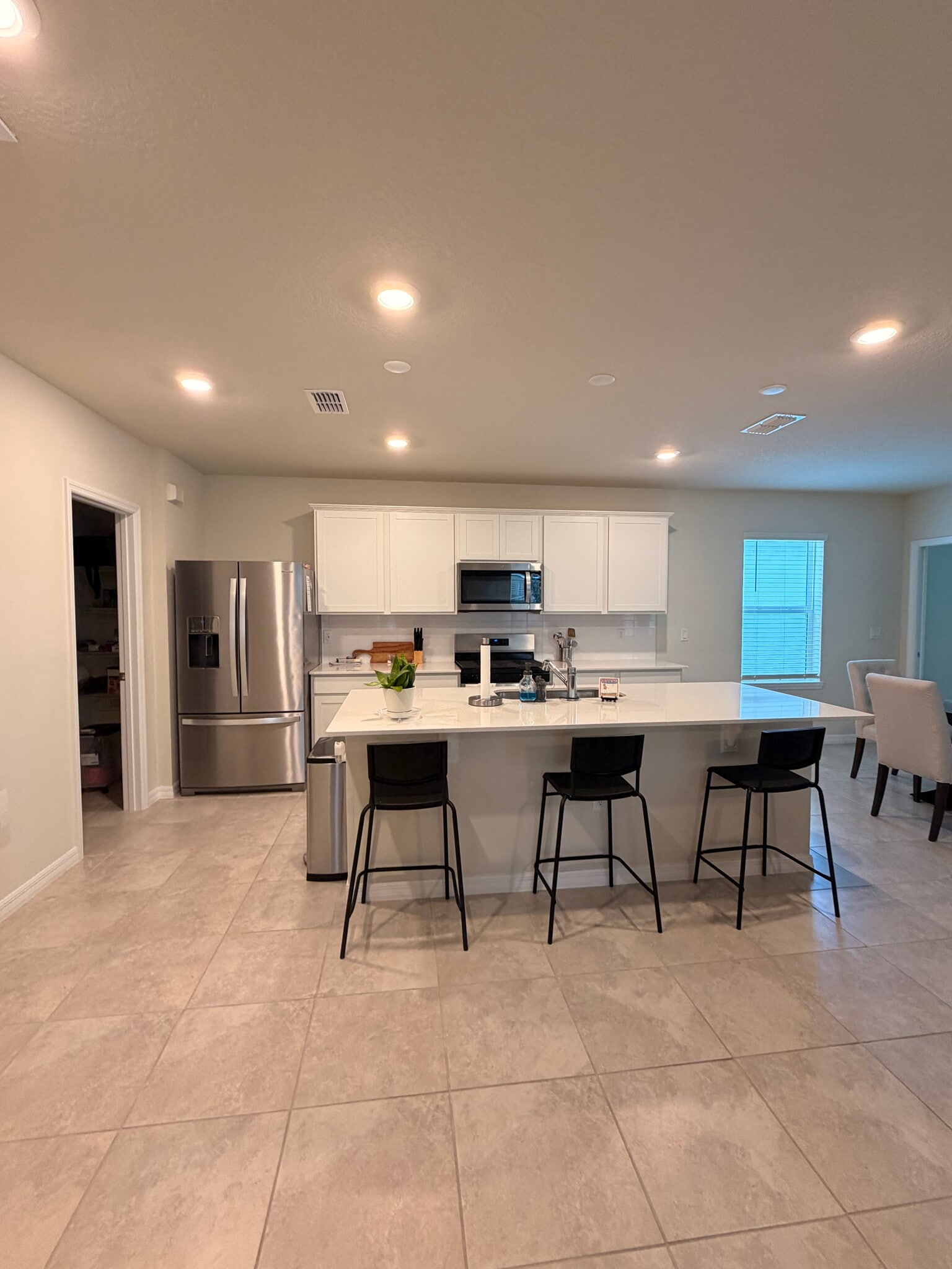 Kitchen with spacious walk in pantry. - 3438 Orange Rose Loop