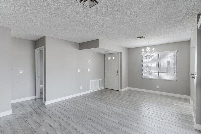 Building Photo - Stylish Upstairs Condo with Dual Primary S...