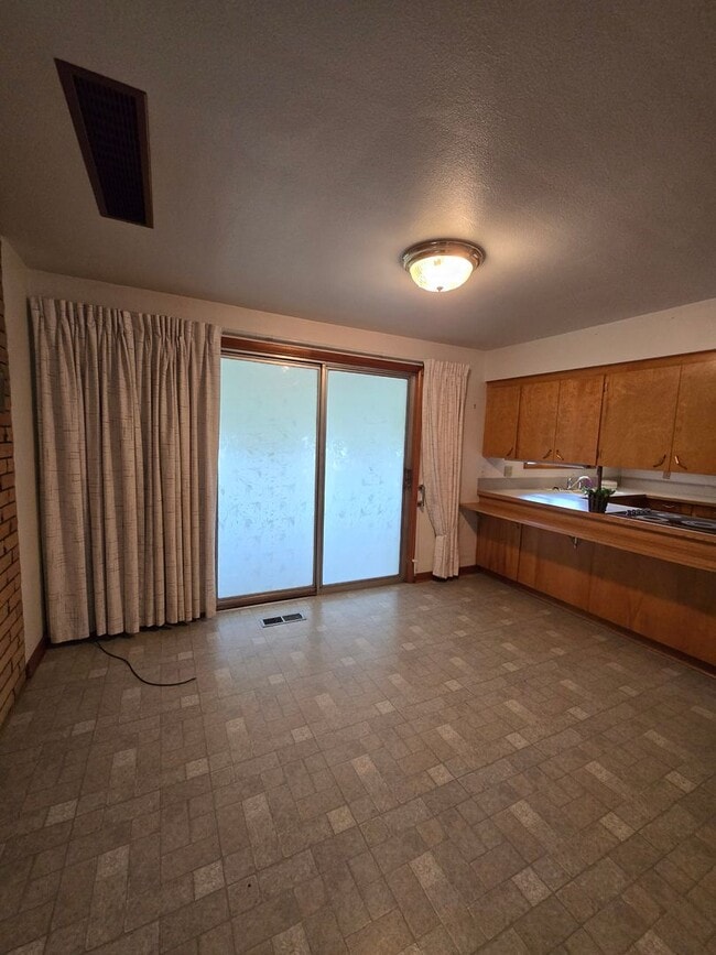 Building Photo - Pet Friendly 3 Bed / 2Bath Home with 2 Garages, Open Air Covered Storage, Large Open Yard, and more!