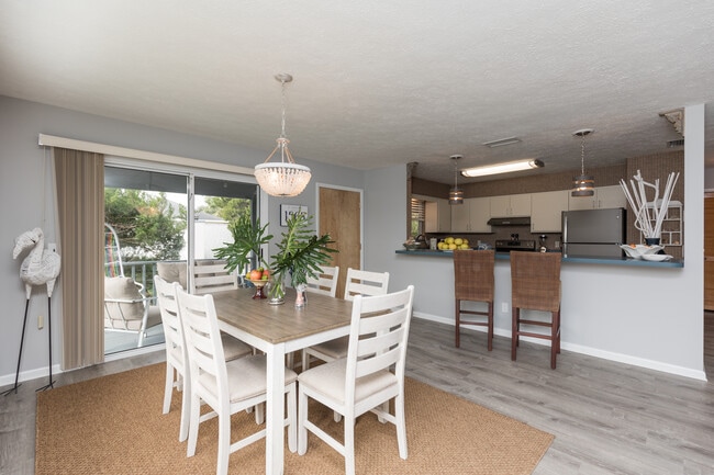 Dining area looking out to balcony and into kitchen - 208 C St