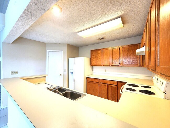 Building Photo - Open Layout; Fenced-in Yard; First Floor B...