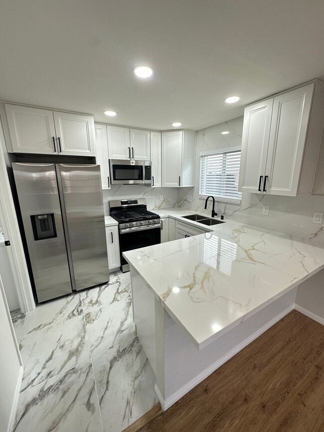 Building Photo - Remodeled 2 Story 3BR/2BA House with Vinyl plank flooring, Fenced backyard & 2 Car garage and more!