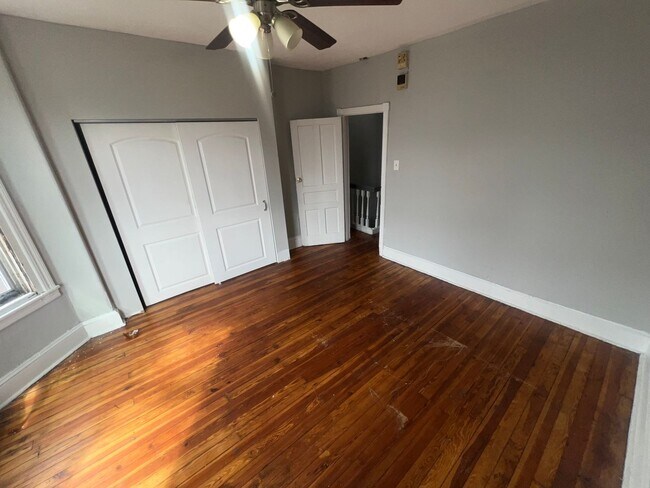 Building Photo - Oversized Classic Row Home w Wood Floors a...