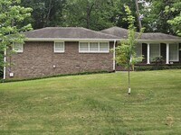 Building Photo - FURNISH, 3 Bedroom 3 Bath Brick Ranch Home