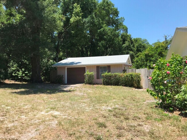 Building Photo - Unique Find! HUGE detached garage/workshop, 3 bedroom, 1 1/2 bath home, screened porch