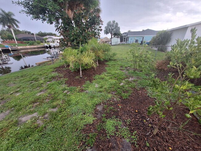 Building Photo - Gulf Access Home on Canal Available Now