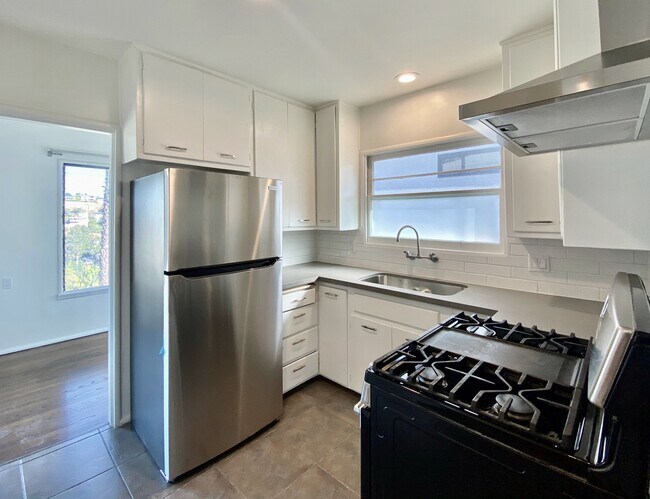 Kitchen has direct access to the dining room. - 1672 Rotary Dr