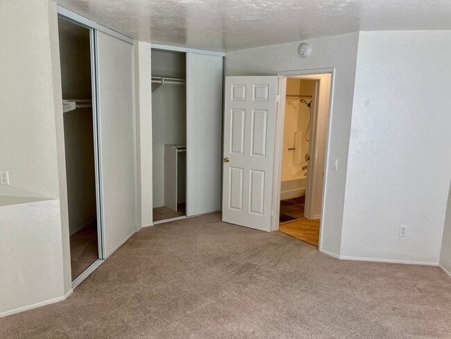 Building Photo - One Bedroom with Garage and IN-Unit laundry in Resort-Style Complex