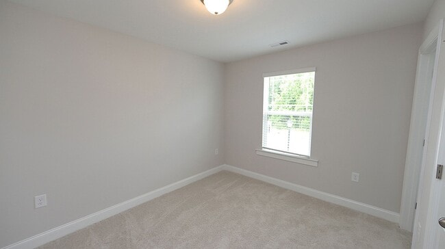 Building Photo - Brand New, End Unit Townhome Close to Down...