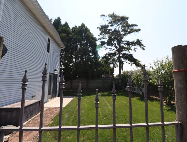 Private fenced yard with patio - 270 Connetquot Rd