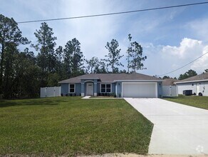 Building Photo - New 3/2/2 fenced home with Many Upgrades i...