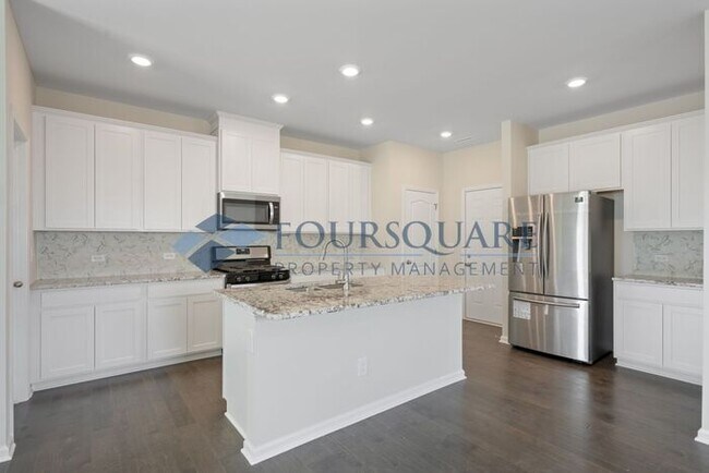 Building Photo - End-Unit Townhome with Loft, Open Floor Plan & Patio, Conveniently Located Near Dining, Shopping,...