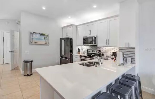 Building Photo - 8117 Princess Palm Ln