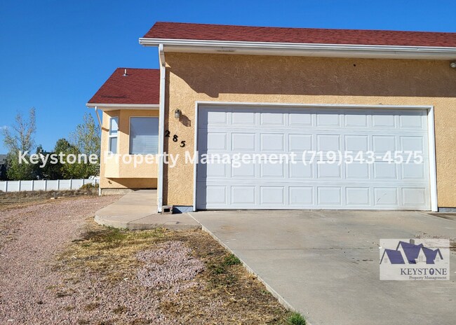 Building Photo - $948 Off Move In Special! Spacious Pueblo West Duplex 3 Bed/3 Bathroom Unit with 2 Car Garage  $1...