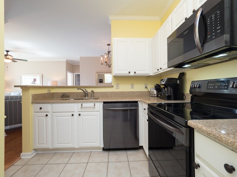 Kitchen is open to main living areas - 1600 Long Grove Dr