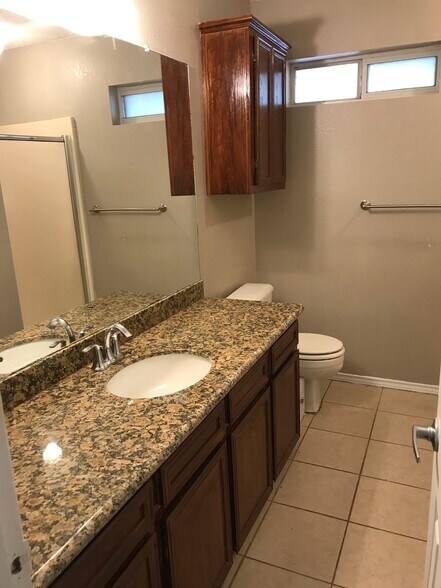 Master bath with walk-in shower and walk-in closet. - 1801 Lexington Circle