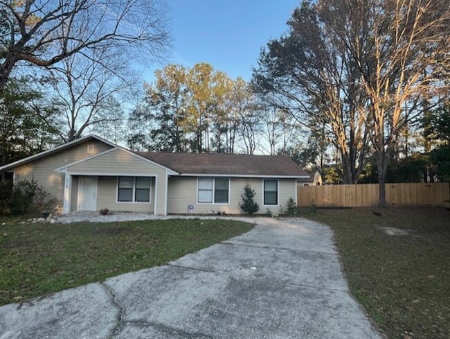 Building Photo - 3/2  home fenced in backyard located acros...