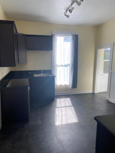 Kitchen with new cabinets and graniet countertops - 1724 NW 24th Ave