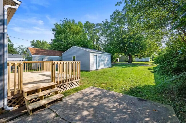 Back deck, garage, and spacious backyard - 2112 N Hollywood Ave