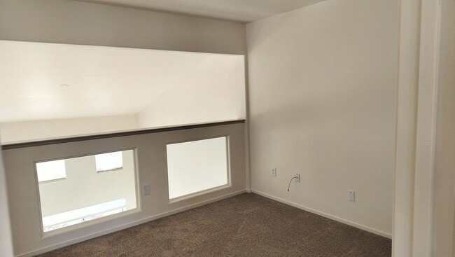 Building Photo - Townhome with Loft + Two Bedrooms/Baths - Designed for Comfort in Gated Community