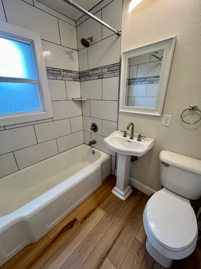 Building Photo - Completely Renovated Three Bedroom Apartment
