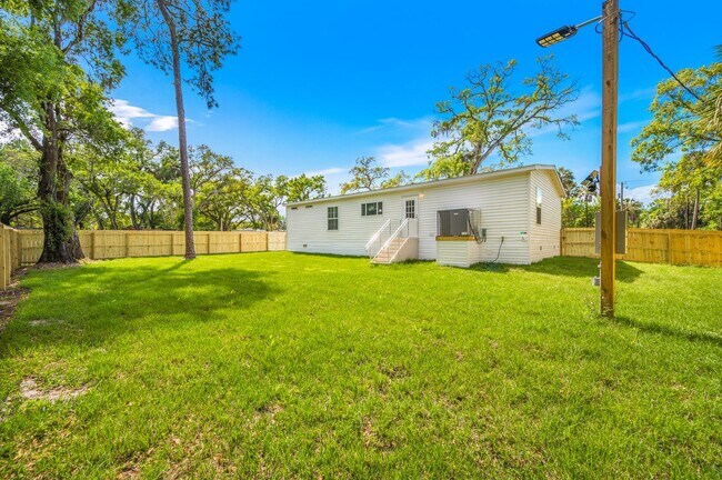 Building Photo - Experience exceptional living at its finest