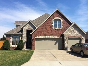 Building Photo - All Brick/Stone 4 Bedroom Home Available! ...