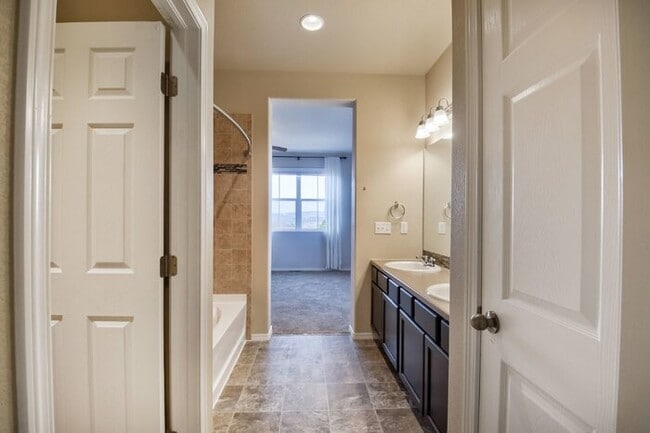 Building Photo - Immaculate 3-Bedroom Townhome with Stainless Steel Appliances and Attached Garage Near Peterson SFB