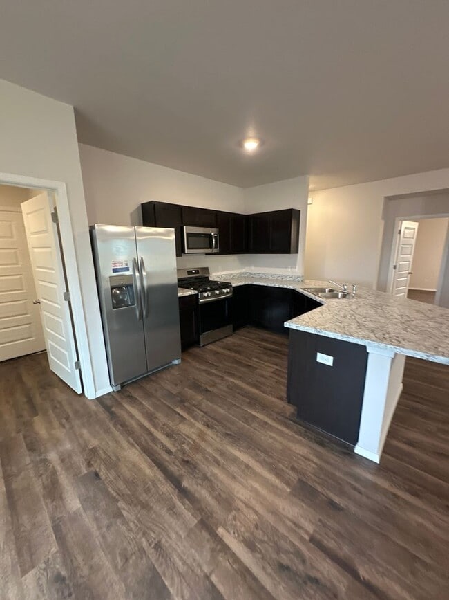 Building Photo - *MARCH MADNESS SAVINGS!* BRAND NEW Three B...
