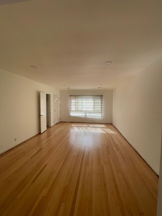 Large living room with solid oak hardwood and recess lighting - 10513 Crenshaw Blvd