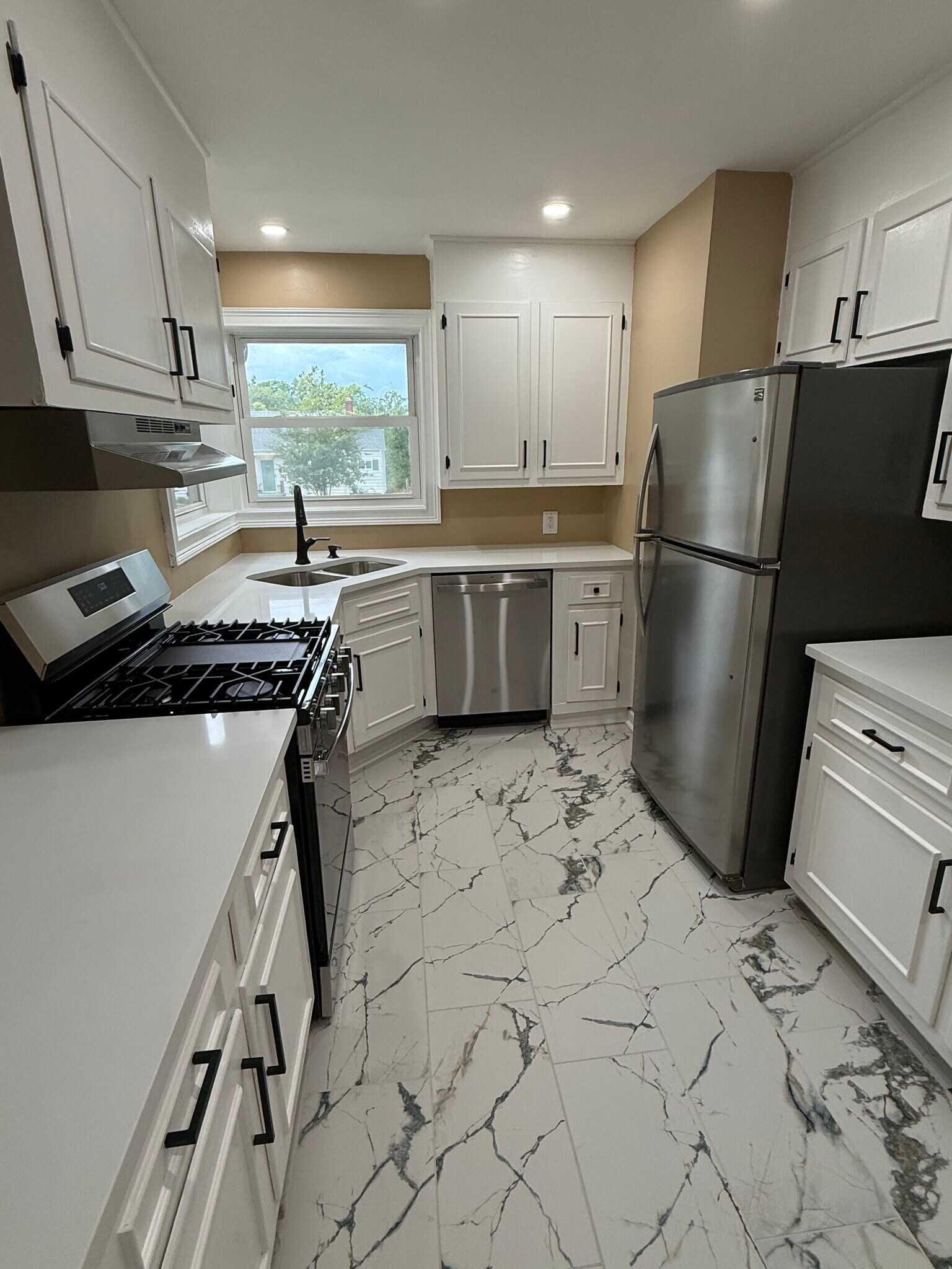 Porcelain Tile Floor adds brightness to kitchen - 18 Waters Ave