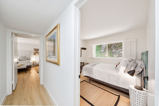 View of Bedroom #2 w/Queen bed and Primary w/King bed - 11411 Dona Pegita Dr