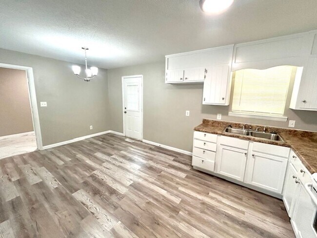 Building Photo - Spacious 4-Bedroom, 2-Bath Home Located in...