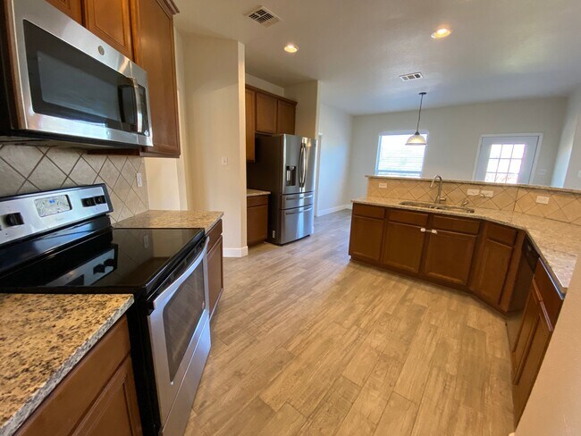 Building Photo - Step into this stunning 4 bedroom, 2.5 bathroom haven that radiates modern elegance and abundant ...