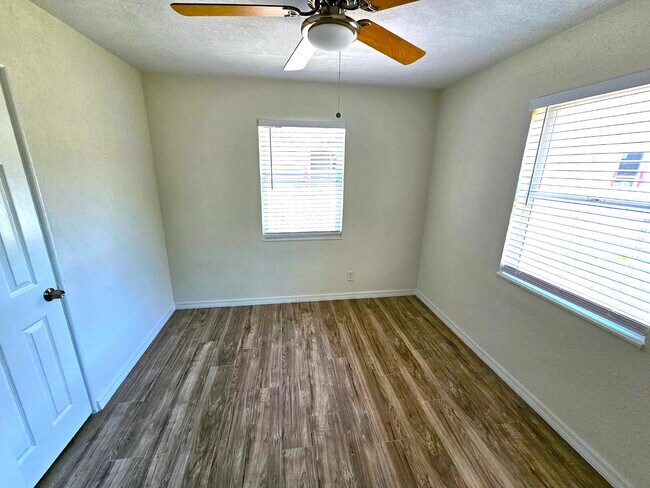 Building Photo - fully renovated 2-bedroom, 1-bathroom home with bonus guest room or office and oversized fenced yard