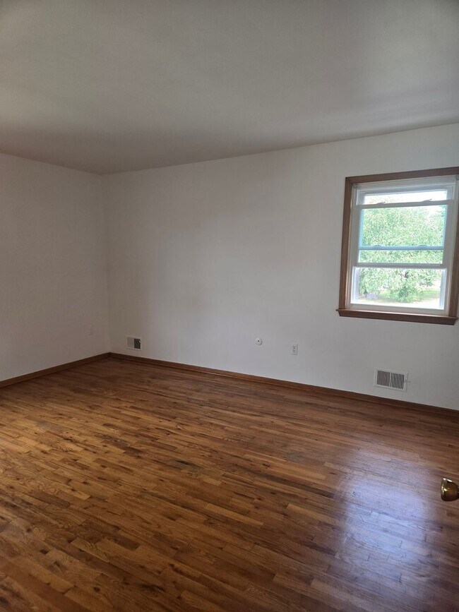 Building Photo - Updates abound at this SPACIOUS, half duplex with 3+ off-street parking spots, 3-bedrooms and 2 f...