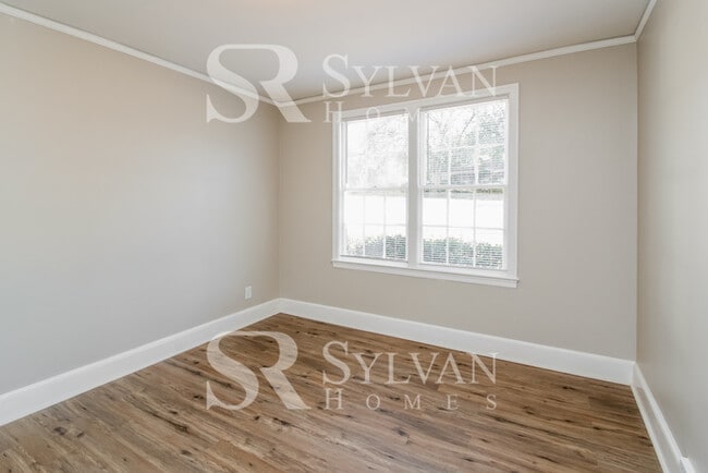 Building Photo - The living is easy in this 3 bedroom, 2 bathroom brick home