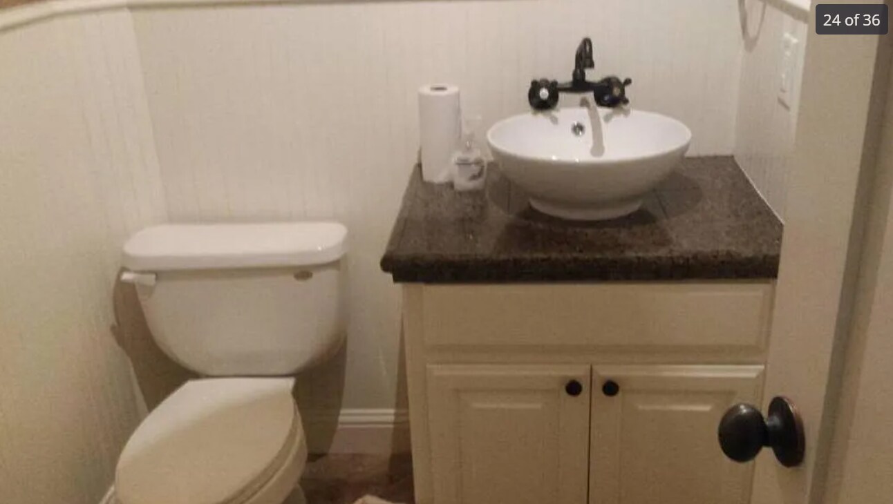 restroom near kitchen and living room - 4413 Spyglass Dr