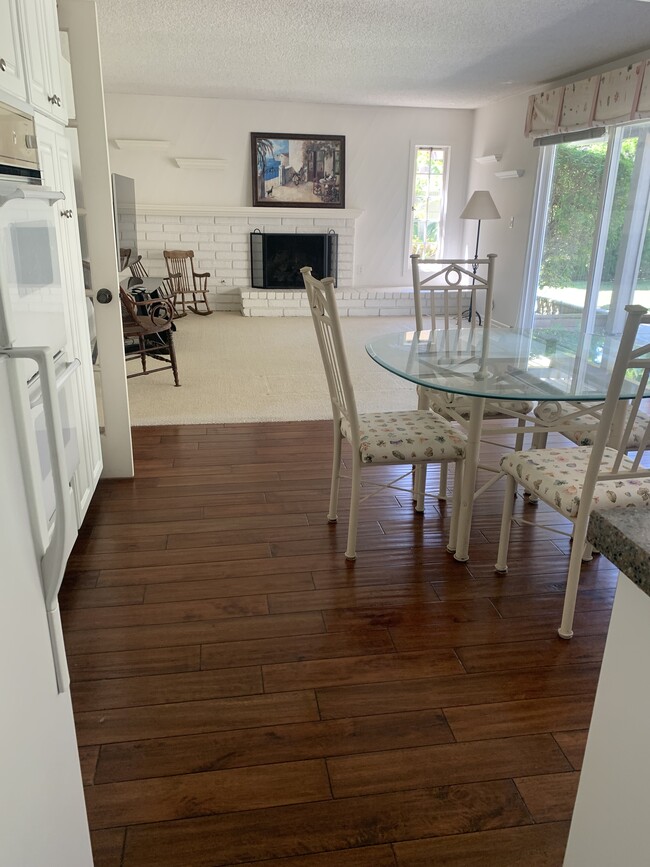 Family room with fireplace adjacent to kitchen - 8561 Windlass Dr