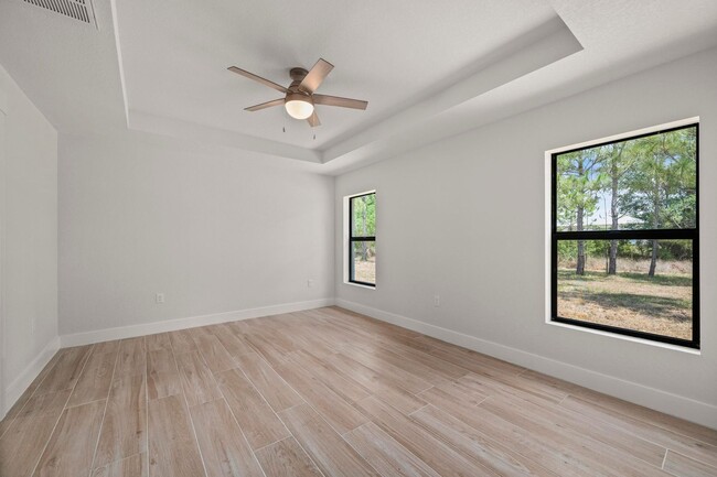 Building Photo - NEW Villa-duplex home with quartz counters, 2-car garage, and a rear patio