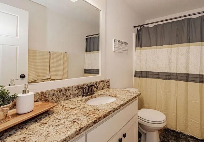 Building Photo - LOCATION, LOCATION, LOCATION - 4 Bedroom 3 Bath Home with TONS of storage. THIS PRICE INCLUDES TH...