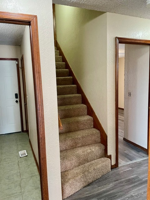 Hallway leading to guest bedrooms, utility and rooftop deck - 100 Village Oaks Dr