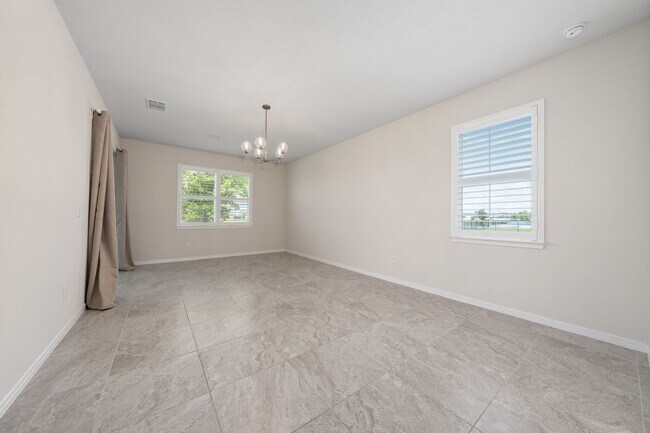 Building Photo - Immaculate Executive Home in Isles of Lake Nona