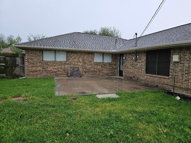 Building Photo - Three bedroom and two bathroom nicely remodeled with new flooring. Large wood fenced backyard