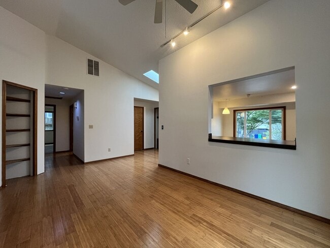 Building Photo - Spacious 3-Bedroom Home with Custom Stone Fireplace, Attached 2-Car Garage & Expansive Backyard i...
