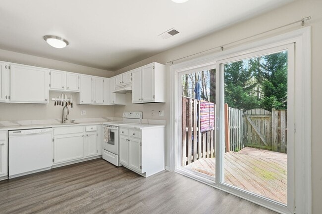 Building Photo - This beautifully refreshed condominium offers a refined blend of style and comfort