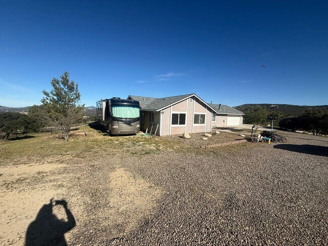 Building Photo - 4BR/2BA HOME w/ attached garage, usable land, fenced in back yard in CAMPO available!