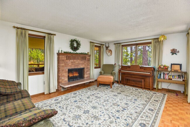 Building Photo - 2700 + sq ft family home has it all! Over 2 acres of land and a stunning view of Lake Pend Oreille