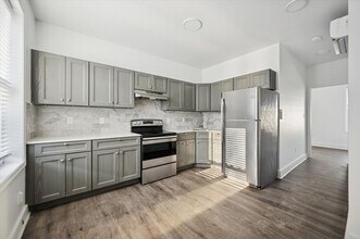 Building Photo - 6143 Glenmore Ave