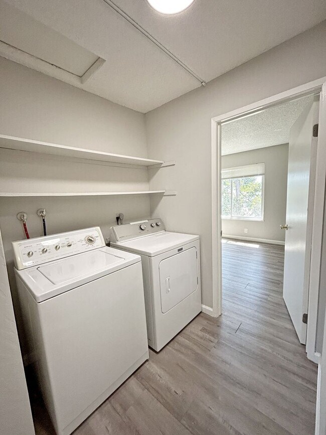 Building Photo - Move-in ready Evergreen townhome with private backyard, detached 2-car garage, and great communit...